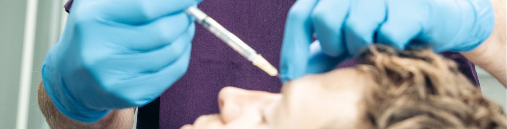 doctor injecting scar filler