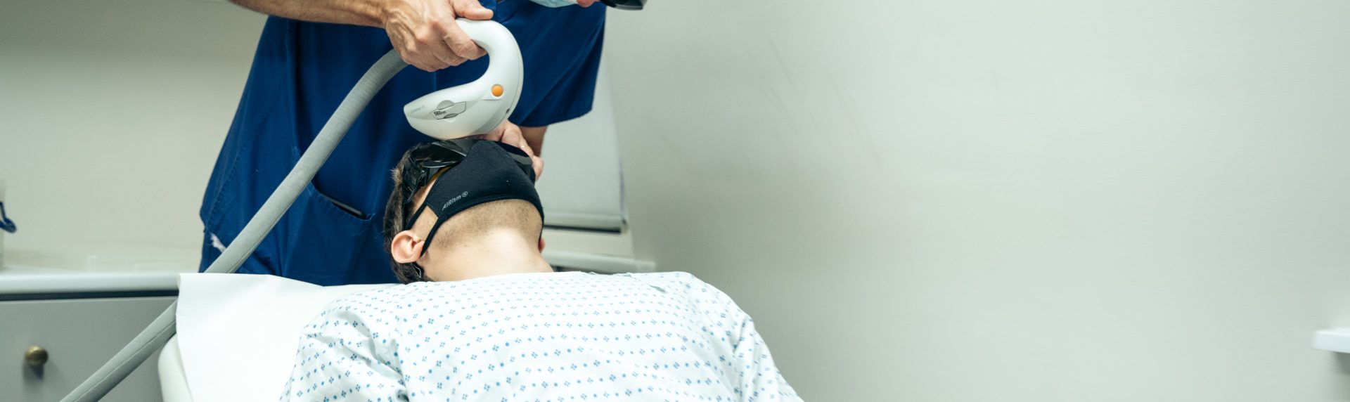 laser treatment for a man patient performed by a doctor