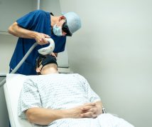 laser treatment for a man patient performed by a doctor