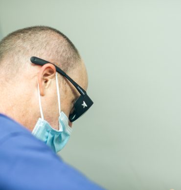 doctor with protective glasses