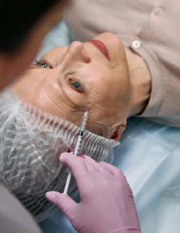 older woman getting scar filler injections