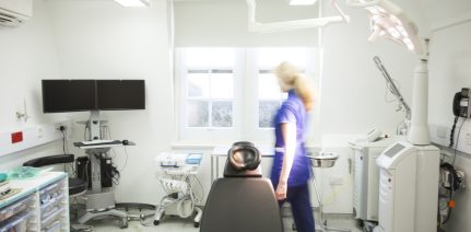 examination room with a doctor