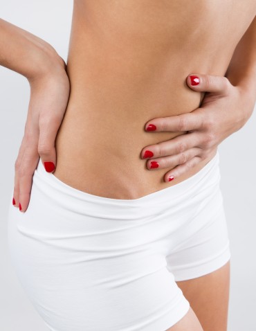 Young Woman With Pain In Her Belly